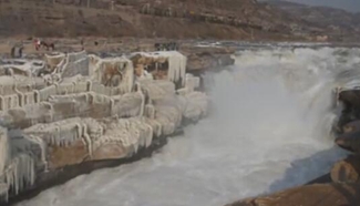 Stunning icicles, rainbow on Hukou Waterfall